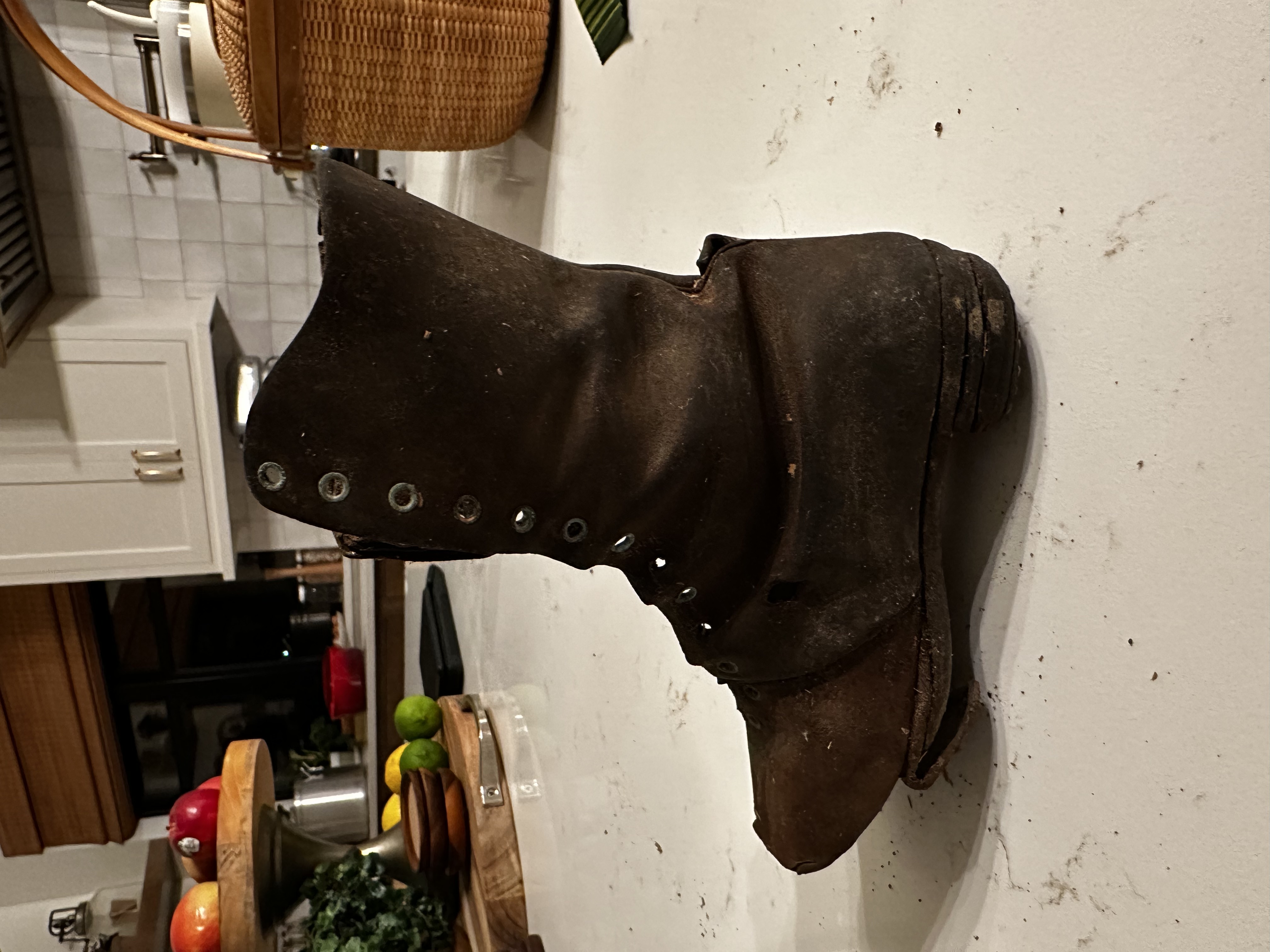 The pioneer boot displayed on a stack of reclaimed boards